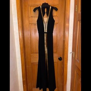 La Femme backless plunge gown with slit- gold bar heading down the middle